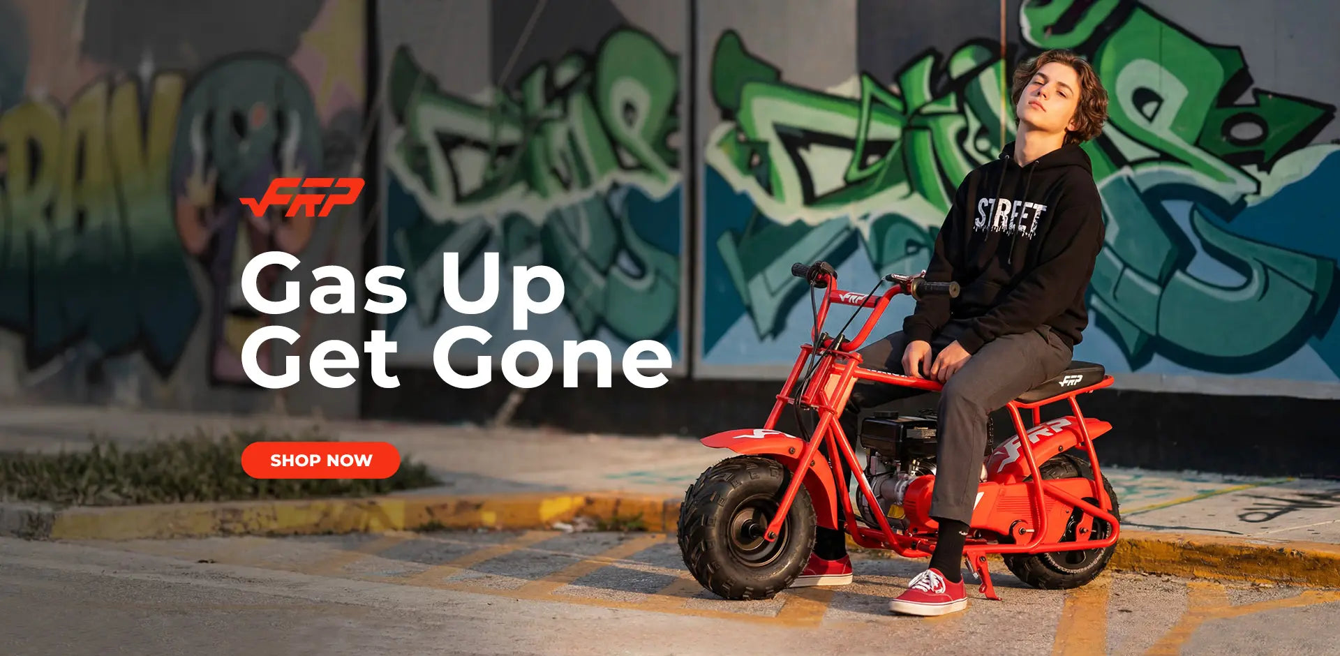 Person sitting on a red motorcycle with graffiti in the background and 'Gas Up Get Gone' text.