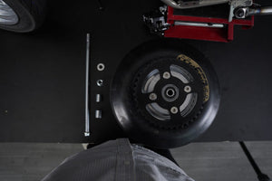 Wide semi-slick rear wheel on the RMB Rebel drag mini bike frame for launch traction