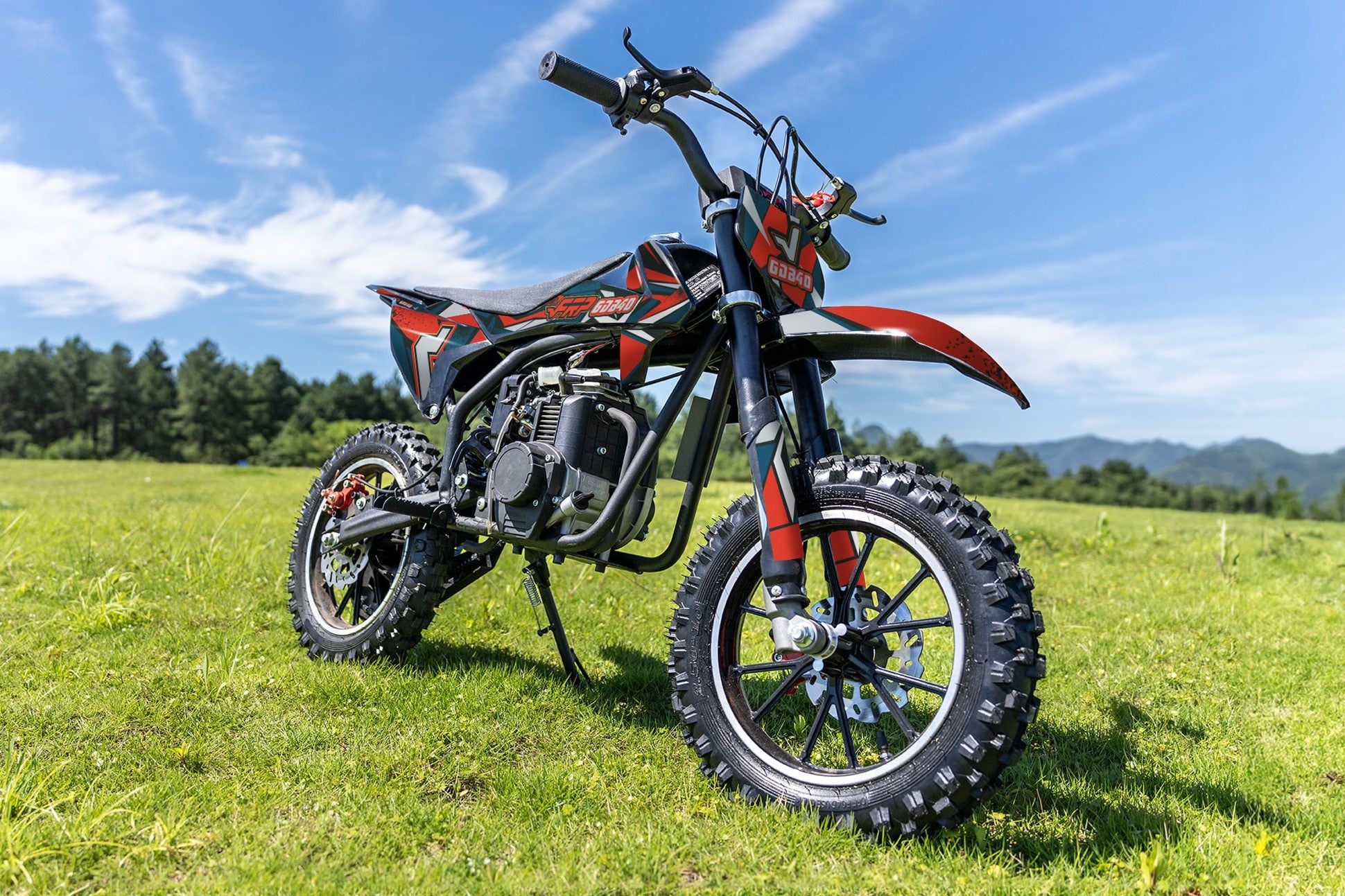 An Ogemaw 40 Kids Dirt Bike is on the lawn.