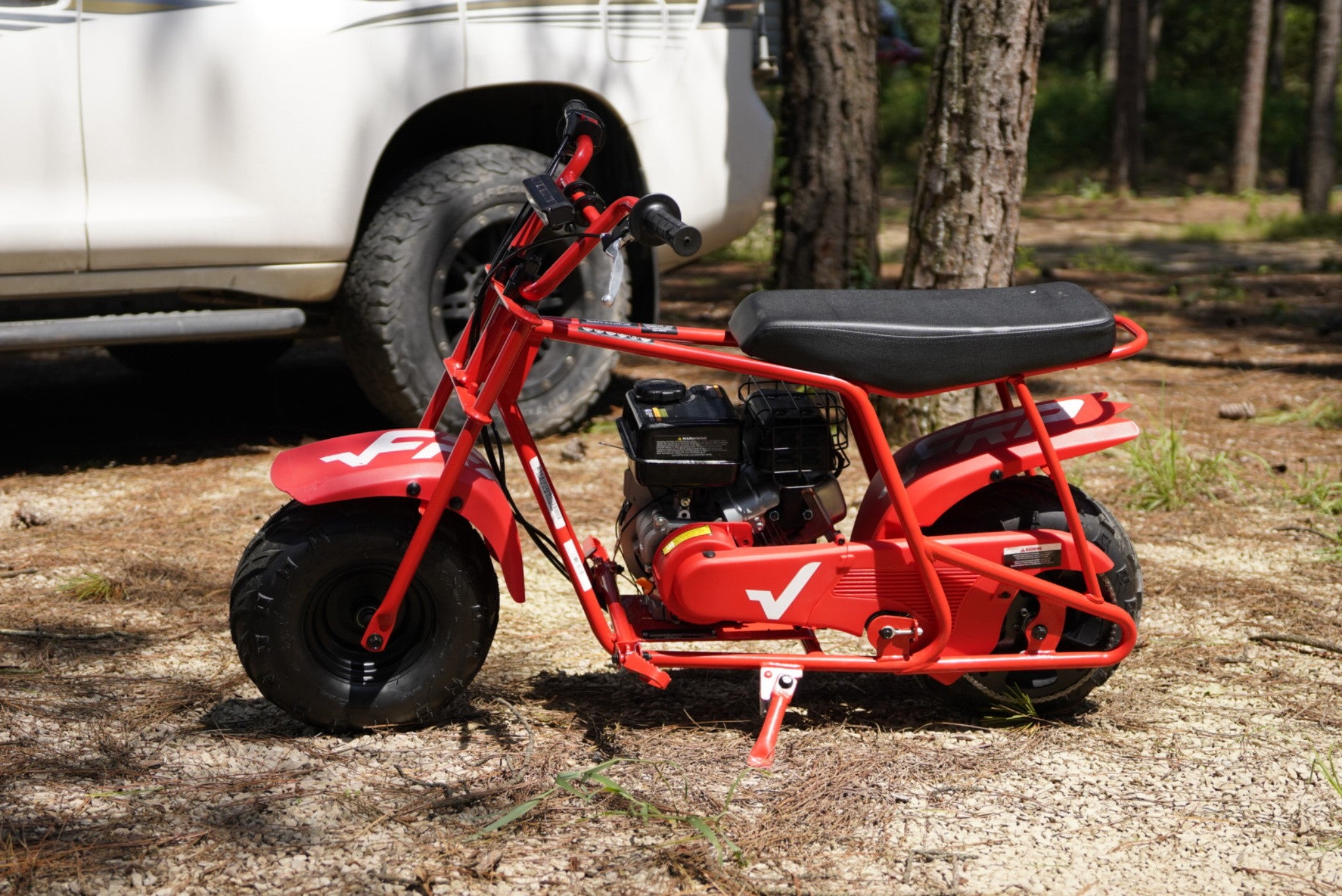 Taking a GMB100 gas mini bike to the camping ground.