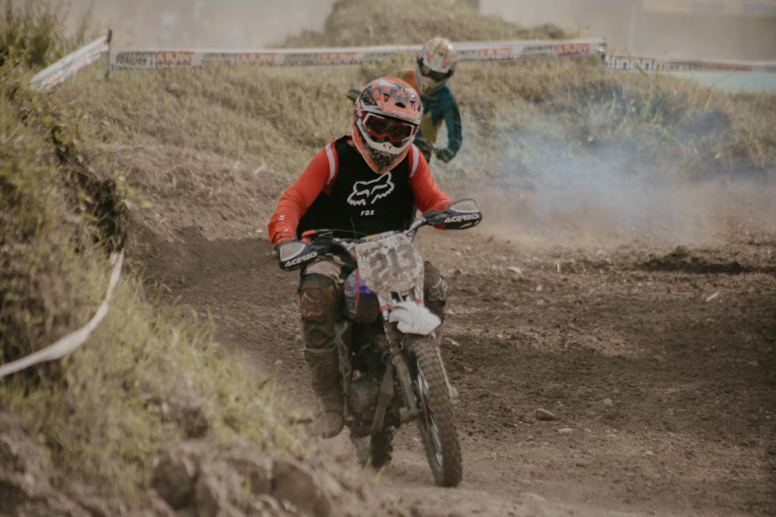 A dirt bike rider who is riding a dirt bike