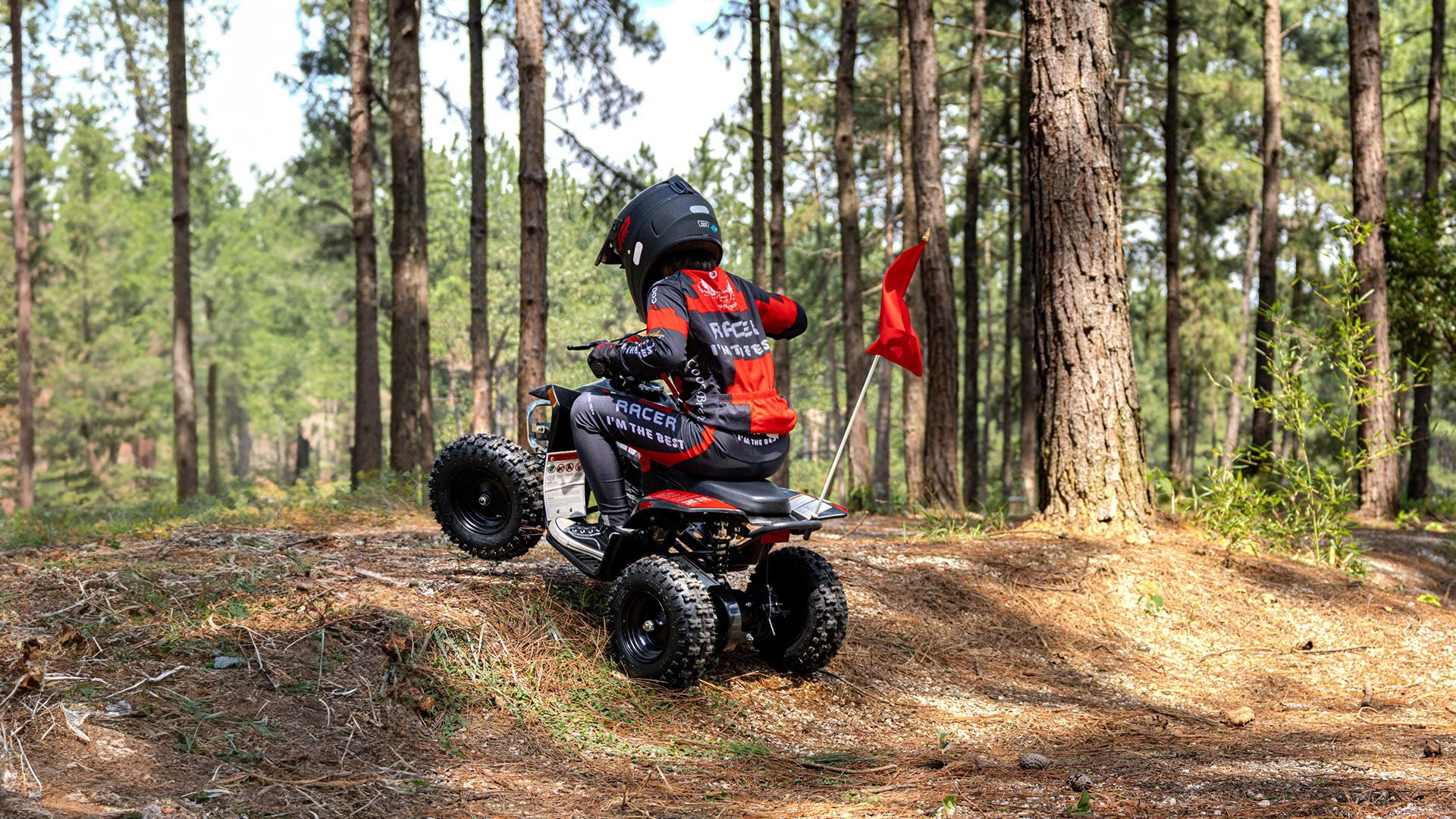 A kid is riding a Sahara 40 mini quad.
