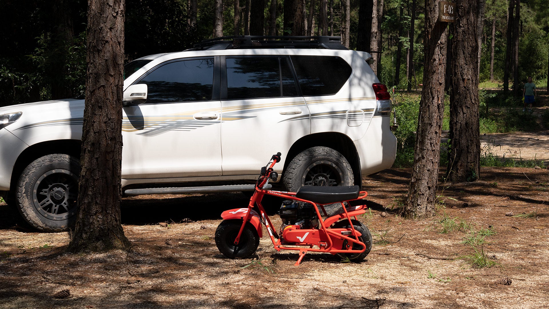 <img src= Where can you take with your GMB100.jpg alt= a GMB100 in the forrest with an SUV/>