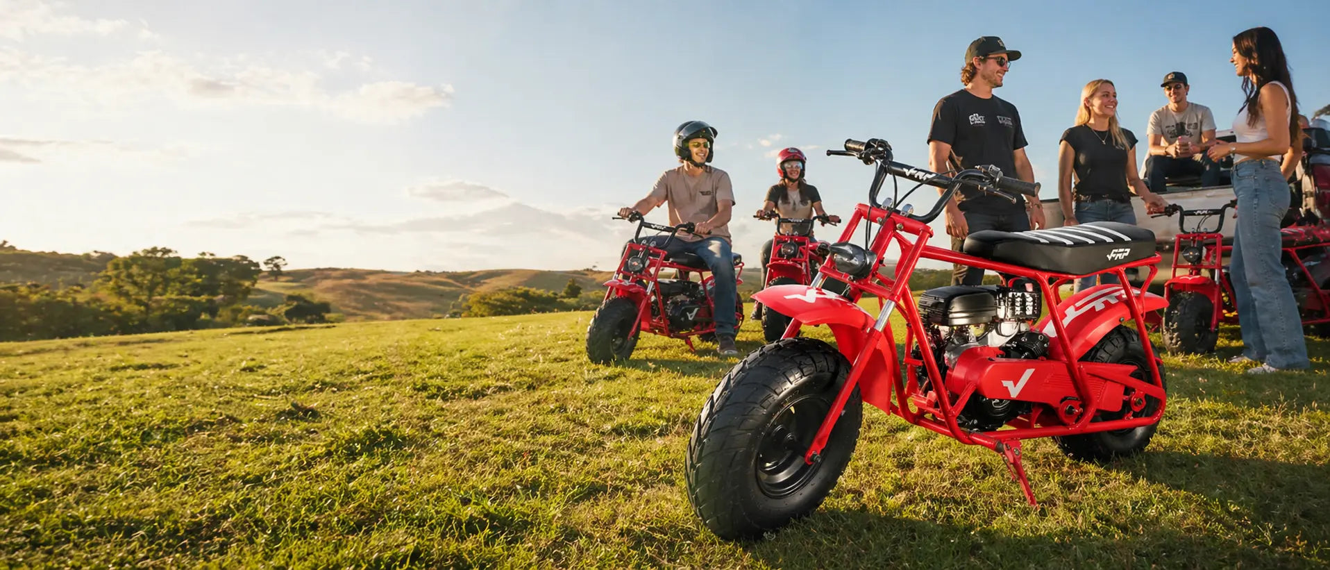 Family preparing an FRP-style gas mini bike for a backyard ride on private property