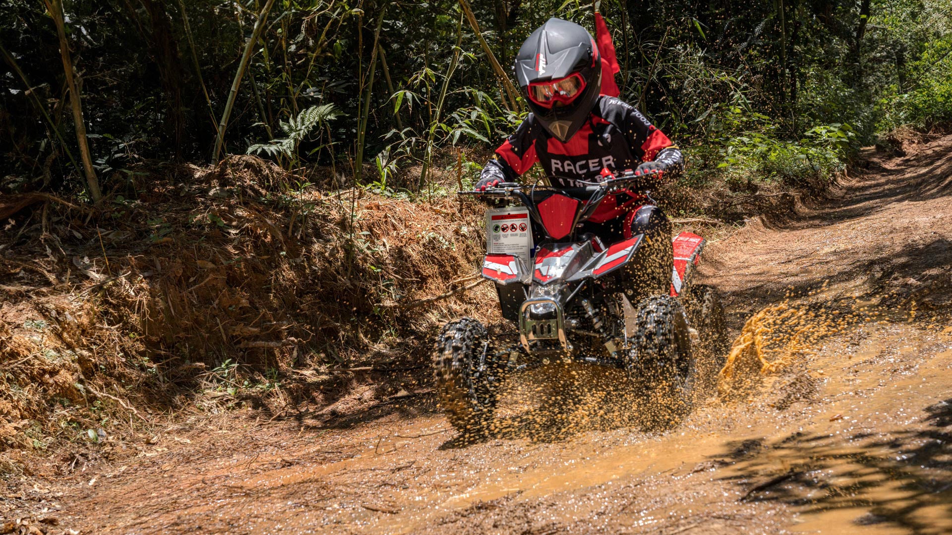 <img src= suspension system.jpg alt= a kid is riding the Sahara 40 gas mini quad on the off-road/>